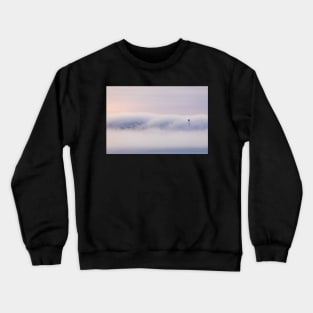 Dreamy thick fog at sunrise over hill Crewneck Sweatshirt